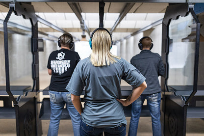 Two friends shooting at the gun range.